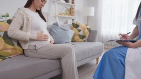 Asian pregnant woman consults with doctor at maternal health center. Attractive expectant mother receive supportive and guidance during a challenging moment in her pregnancy at prenatal care clinic. - Powered by Shutterstock - Get 15% off with code: PIKWIZARD15