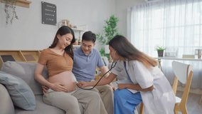 Asian young pregnant wife visit maternal health center with her husband. Attractive expectant couple consulting with doctor, receiving support and guidance during a prenatal checkup at the clinic. - Powered by Shutterstock - Get 15% off with code: PIKWIZARD15