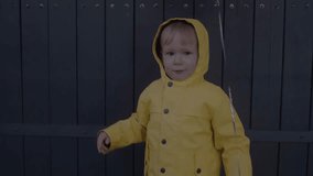 Child in a costume celebrates Halloween, holding a pumpkin basket on the street. Child grimaces at the camera. Concept of Halloween, holiday, and childhood. 4K slow-motion video - Powered by Shutterstock - Get 15% off with code: PIKWIZARD15