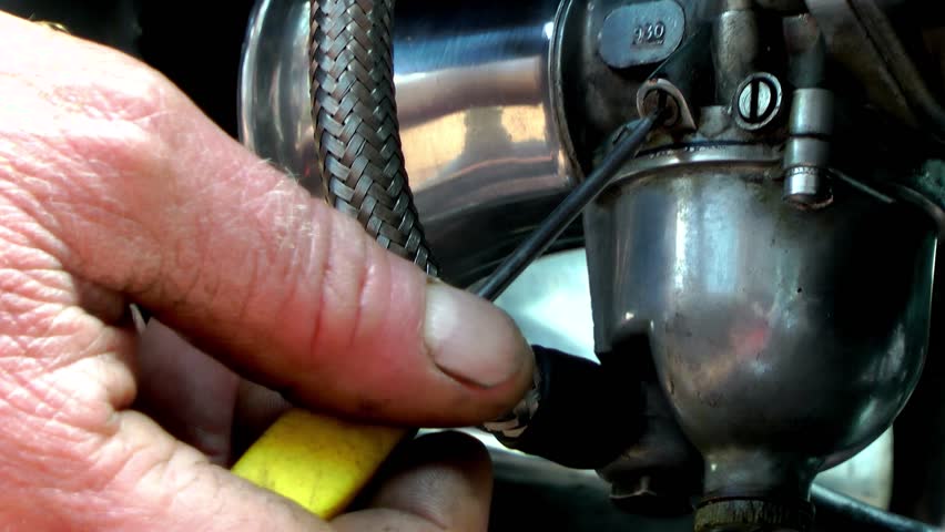 Motorcycle - Mechanic Adjusting Carburetor 