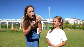 Happy young mother and her cheerful daughter playing together with soap bubbles on a sunny day in a green park, enjoying a beautiful moment of family fun and bonding outdoors - Powered by Shutterstock - Get 15% off with code: PIKWIZARD15