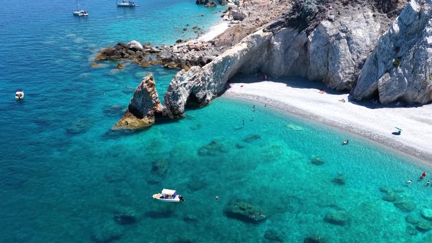 Panoramic aerial view of the beautiful Lalaria beach at Skiathos Island, Sporades, Greece, with the natural rock arch and turquoise shining sea