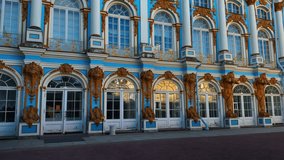 A horizontal, mid-level shot capturing the stunningly ornate Baroque facade of the Catherine Palace in Tsarskoye Selo, featuring its iconic bright azure blue walls, white columns, gilded stucco decor - Powered by Shutterstock - Get 15% off with code: PIKWIZARD15