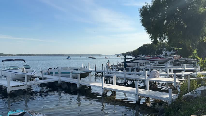 Boats On White Wooden Dock On Geneva Lake In Wisconsin, USA. static shot