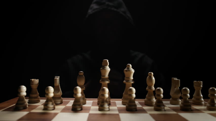 Dramatic Close-up of Chess Pieces being Moved by Mysterious Player Under Soft Light Depicting Intelligence, Strategic Thinking, Risk Management, Decision Process and Abstract Concept of Mind Games and
