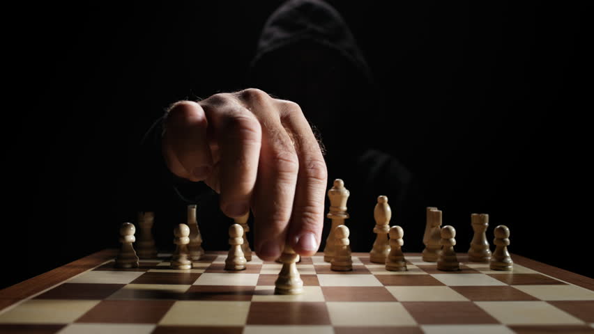 Dramatic Close-up of Chess Pieces being Moved by Mysterious Player Under Soft Light Depicting Intelligence, Strategic Thinking, Risk Management, Decision Process and Abstract Concept of Mind Games and