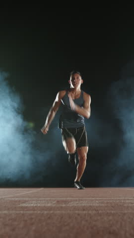 athlete man running from darkness to light vertical slow motion fullHD power motivation determination strength focus spirit victory energy discipline success inspiration movement