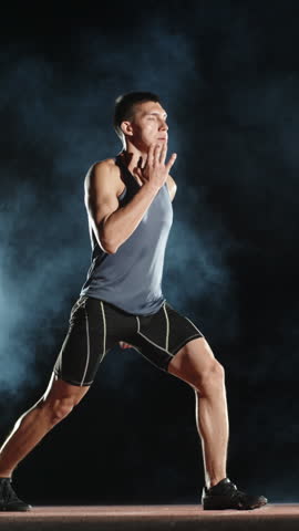 athlete man stretching before run vertical slow motion fullhd body care discipline focus balance wellness flexibility health awareness morning energy motivation physical harmony