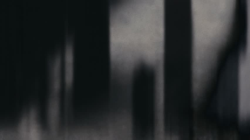 Microfilm Transition: Vintage-style overlay and cut transitions mimicking microfiche motion, ideal for seamless video edits and layered effects in editing software.