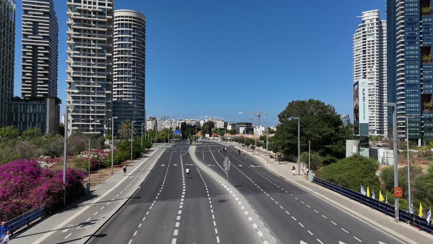 Tel Aviv, Israel – 2025 – Aerial view of empty streets filled with cyclists during Yom Kippur, the day of bicycles in Israel