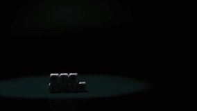 Letter blocks forming "NEW YEAR" are highlighted against a dark background, with a smooth camera zoom in that emphasizes the festive message and mood - Powered by Shutterstock - Get 15% off with code: PIKWIZARD15