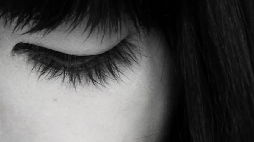 A woman is crying, sad, loss, hopeless about everything, black and white, sad footage 
