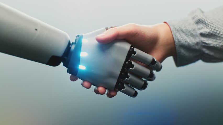Close up of Human and Robotic Hand Shaking, Glowing With Digital Light. Human and Robot Handshake Symbolizing AI Collaboration. Concept of Connection Between People and AI in Future Technology.