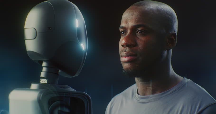 Close Up of African American Man Standing Next to Sleek Humanoid AI Robot. Both Look Forward With Neutral, Thoughtful Expression in Soft, Moody Light. Concept Human Robot Partnership. Portrait.