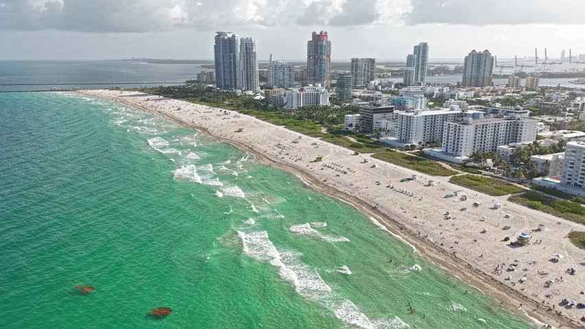 Drone Aerial View of South Beach Miami, Florida USA, Beachfront Buildings, White Sand and Turquoise Ocean