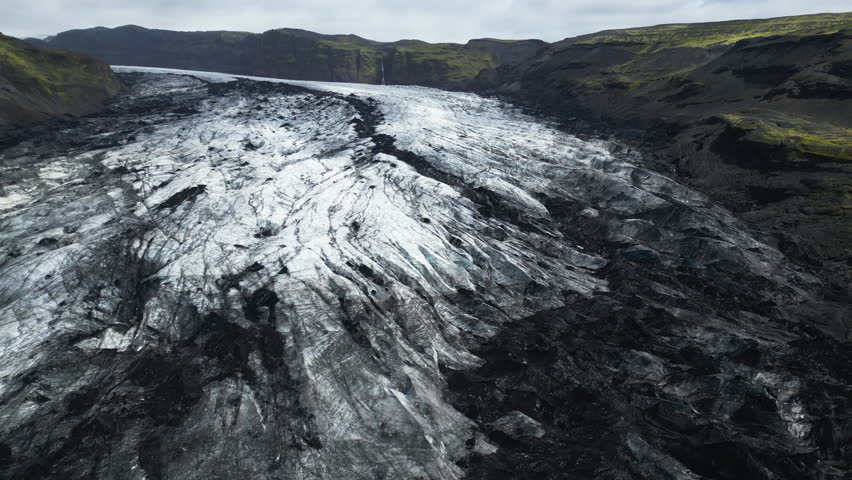 Aerial panoramic establishing of Solheimajokull Glacier, Iceland climate change