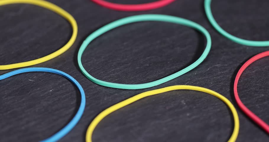 rubber bands for money , empty scattered thin rubber bands of different colors for packaging and organizing paper money