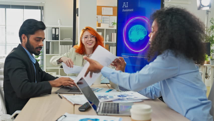 Multiethnic business professionals collaborate in modern office using AI virtual assistant and big data analytics to connect insights, driving strategic innovation through intelligent automation - Powered by Shutterstock - Get 15% off with code: PIKWIZARD15