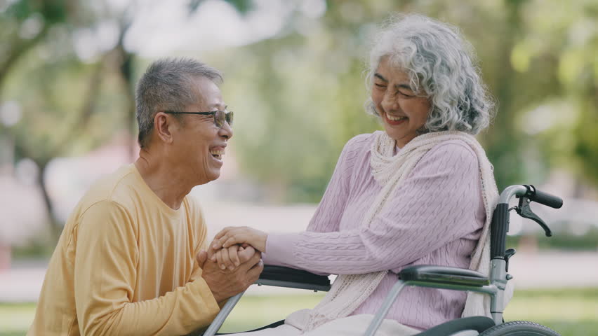 Senior Asian couple enjoying time together in park