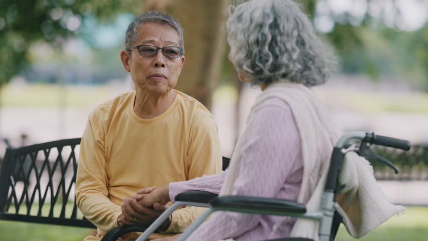 Senior Asian couple enjoying time together in park