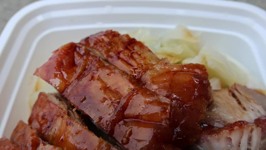 chinese food takeout lunch container with roast duck and glazed pork meat over white rice with cabbage (asian meal plastic) delicious bbq barbecue sweet sour combo platter cut sliced 