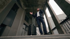 Caucasian middle aged business man arriving in new city talk cellphone standing near airport building with baggage suitcase talking mobile phone businessman order taxi employer travel trip concept - Powered by Shutterstock - Get 15% off with code: PIKWIZARD15