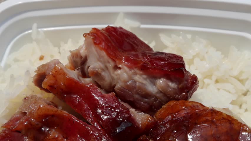 chinese food takeout lunch container with roast duck and glazed pork meat over white rice with cabbage (asian meal plastic) delicious bbq barbecue sweet sour combo platter cut sliced 
