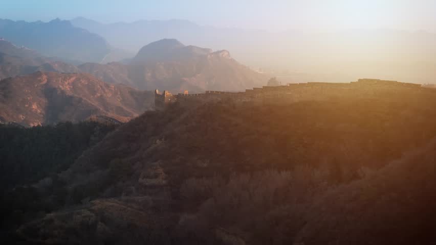 Aerial shot of the Great Wall of China at sunrise.
