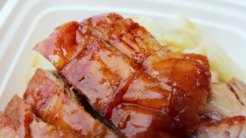 chinese food takeout lunch container with roast duck and glazed pork meat over white rice with cabbage (asian meal plastic) delicious bbq barbecue sweet sour combo platter cut sliced 