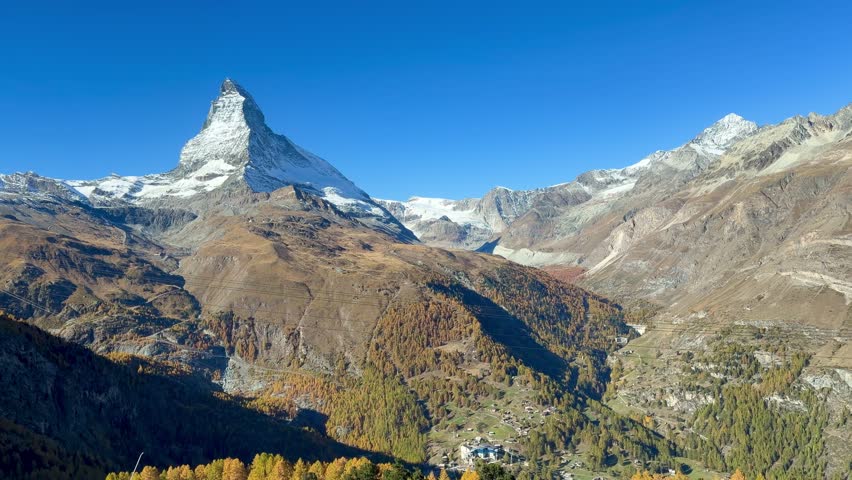Take the Gornergrat Railway from Zermatt to the summit, with views of the autumnal landscape. Beautiful Swiss mountain scenery.