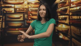 Woman pushes hands forward in naval museum building among ship models on shelves and display racks, showing a dismissive push gesture; disgust refusal. - Powered by Shutterstock - Get 15% off with code: PIKWIZARD15