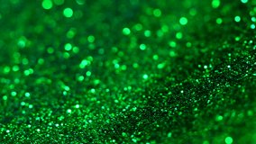 Green abstract background. Fluid liquid flow. Shimmer and shine. Vibrant green glow. Metallic foil texture. Luxury chrome waves. Bright satin swirls. Premium 4k video. Futuristic glitter design. - Powered by Shutterstock - Get 15% off with code: PIKWIZARD15
