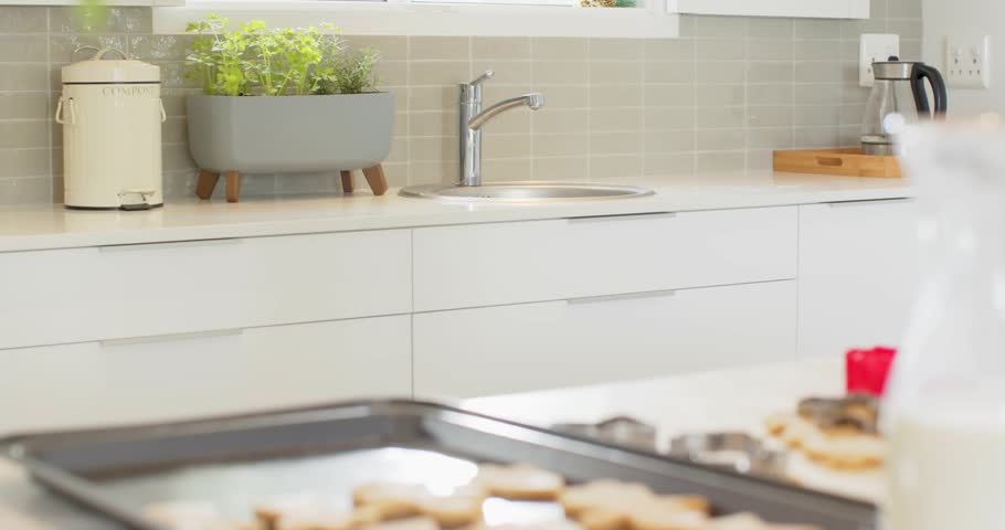 At start, camera shifting focus and framing raw star-shaped cookies to highlight baking process. Kitchen, culinary, minimalist, home, baking, modern, food prep