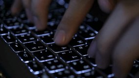 Close up of hands rapidly typing on a backlit laptop keyboard. Fingers press keys in dark environment. Useful for technology, business, or remote work. - Powered by Shutterstock - Get 15% off with code: PIKWIZARD15