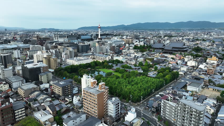Shoseien Garden With Kyoto Tower In The Distance In Kyoto, Japan. - aerial shot