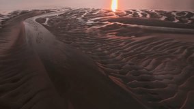 Sunset Light Glinting Off Tidal Pools And Rippled Sand With Sparkling Inlet. Golden Hour. Fleetwood, Lancashire, UK. - Powered by Shutterstock - Get 15% off with code: PIKWIZARD15