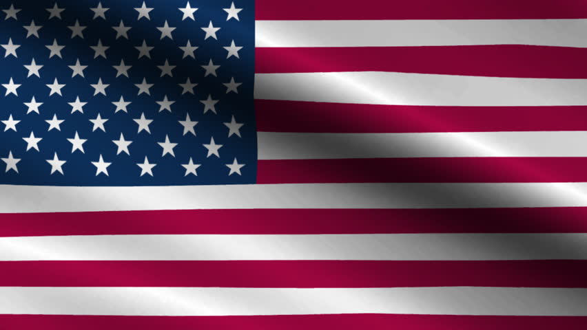 The American flag waves in the wind, showcasing its stars and stripes.