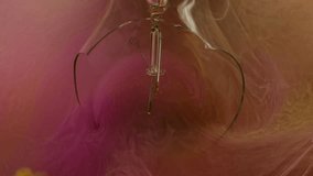 Cracked light bulb. Vapor paint. Defocused orange pink color fluid splash smoke cloud filling glass in water on abstract background. - Powered by Shutterstock - Get 15% off with code: PIKWIZARD15
