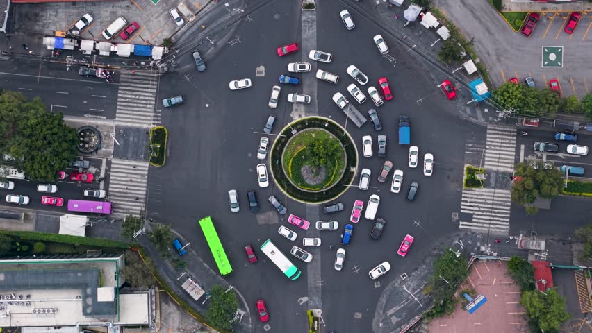 Drone filming of glorieta with constant vehicle flow in Mexico City