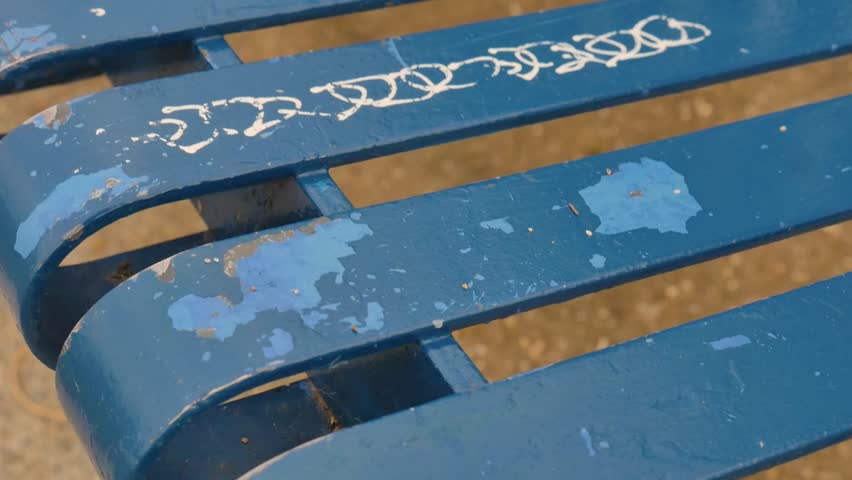 Graffiti on a park bench