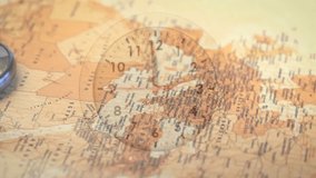 Starting clock hands moving over map, compass staying still as camera panning eastward showing time. Cartography, navigation, exploration, vintage, heritage, geographic, travel - Powered by Shutterstock - Get 15% off with code: PIKWIZARD15
