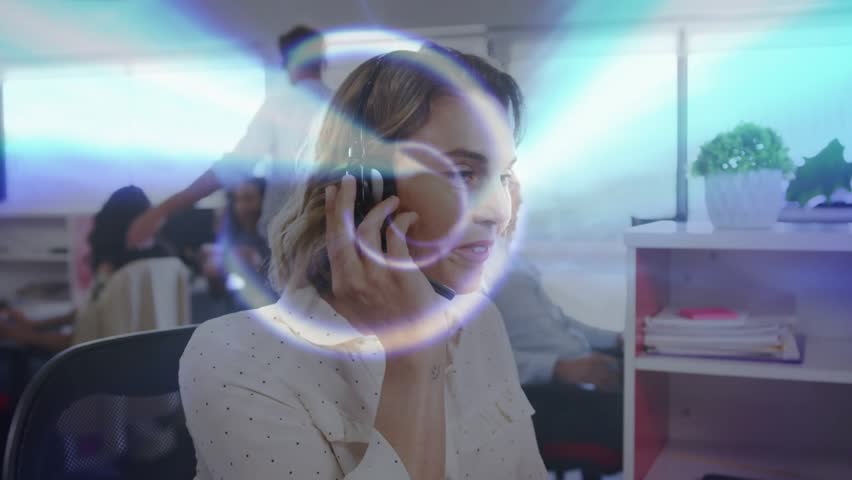Female call center agent donning headset and initiating call with glowing overlays framing face. Collaboration, communication, technology, modern, professional, productivity, teamwork - Powered by Shutterstock - Get 15% off with code: PIKWIZARD15