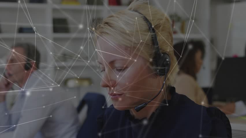 Tech support agent wearing headset answering call while network overlay mapping flows animating. Collaboration, communication, teamwork, professional, digital, connectivity, modern - Powered by Shutterstock - Get 15% off with code: PIKWIZARD15