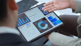 Business colleagues review data on a tablet, discussing performance metrics, market trends, and strategic insights for informed decision making - Powered by Shutterstock - Get 15% off with code: PIKWIZARD15