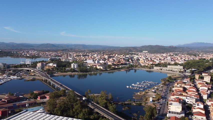 Wide Angle Aerial Orbit of Sunny Olbia City and Bay in Sardinia
