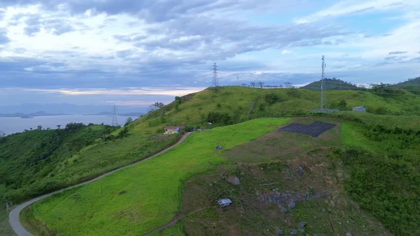 Scenic View of Rolling Hills and Telecommunication Towers