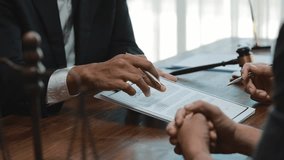 Professional legal team collaborating during contract negotiation, reviewing critical terms and strategic business agreement in modern corporate office setting - Powered by Shutterstock - Get 15% off with code: PIKWIZARD15