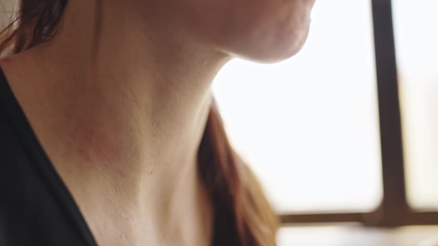 Close up of woman's mouth chewing food