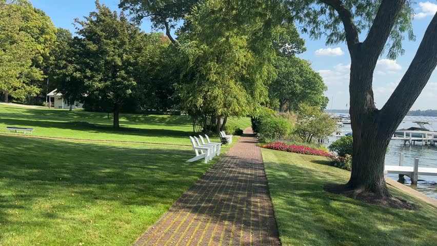 Sunny path by Lake Geneva in Wisconsin, peaceful and scenic stroll