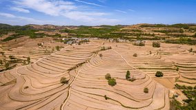 Stunning aerial view of terraced agricultural fields on the Loess Plateau in Shaanxi Province, China, showcasing traditional farming methods and landscape patterns. - Powered by Shutterstock - Get 15% off with code: PIKWIZARD15